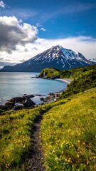 A serene landscape with a snow-capped mountain overlooking a tranquil body of water