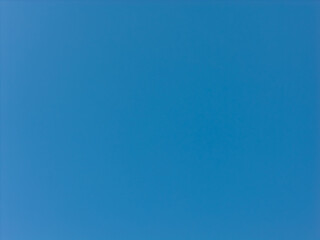 Expansive unblemished blue sky presenting a vast, open backdrop, excellent for concepts of freedom, tranquility, weather, and a serene, unlimited environment