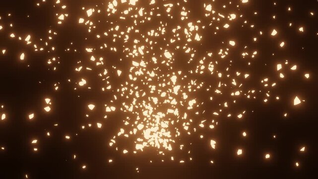 Exploding golden fire ember fragments flying and scattering on pitch black background