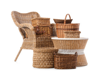 Obraz premium Rattan armchair and different wicker baskets isolated on white background