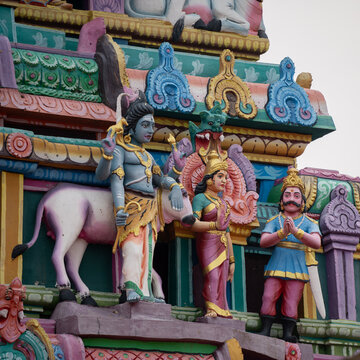 Statue of Lord shiva and goddess Parvathi with Nandi ( Bull ) at a temple complex in Tamilnadu, India 