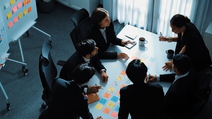 Top view of business people brainstorm idea by using sticky notes while planning marketing strategy...