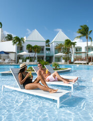 Relaxing in paradise by the poolside in aruba under a clear blue sky