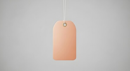 Mockup of a peach colored tag or label with string