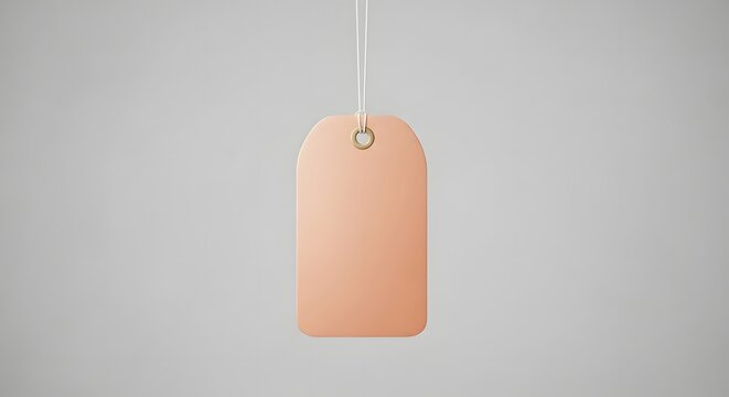 Mockup of a peach colored tag or label with string