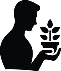 Silhouette of a person holding a small plant in their hands
