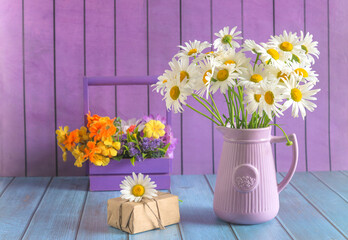 Happy Mother's day greeting card template; bouquet of white daiisy flowers on a wooden background