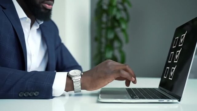 Black Businessman Typing on Laptop Keyboard with Checkboxes on Screen, Close-up on Hands and Fingers, Stock Footage