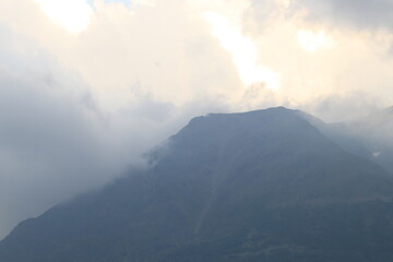 Fototapeta premium The North Caucasus Mountains in clouds and fog on a summer day