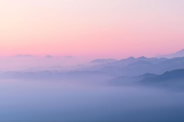 Fototapeta premium Serene Misty Mountain Layers at Sunrise Pink and Purple Gradient