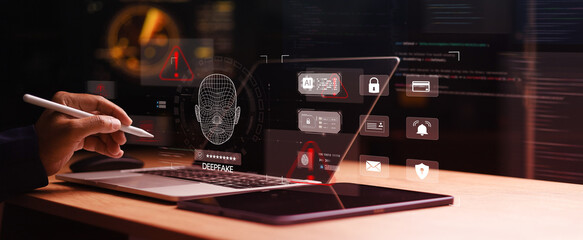Cybersecurity professional analyzing AI deepfake detection system with facial recognition scan, fraud warning alerts, and digital identity protection interface on laptop.