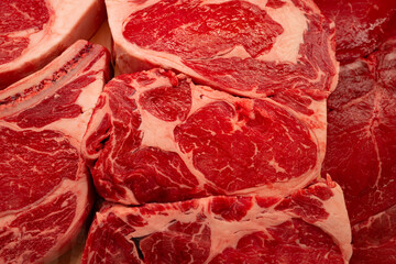 Obraz premium Beef looks fresh and premium. The beef shows rich natural marbling. Beef is ready for cooking use. Beef gives us high protein quality.