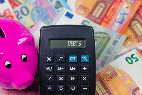 Pocket calculator with the word &ldquo;Debt&rdquo; on the display