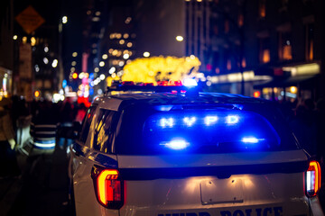 NYPD police car during patrol. NYPD police car with sirens on. NYPD police car at city intersection. NYPD police car in Manhattan street. © Volodymyr