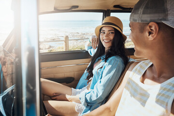 Happy couple, drive and travel with car on beach coast for road trip or weekend getaway together. Man, woman or journey with smile, sun or vehicle for transportation, outdoor adventure or vacation © BuyoutReese09/peopleimages.com
