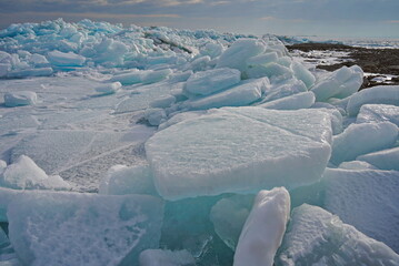 Hummocks on the Kapchagai reservoir. Ice blocks covering the lake. Winter time.