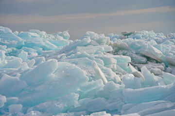 Hummocks on the Kapchagai reservoir. Ice blocks covering the lake. Winter time.