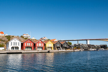 Obraz premium Colorful wooden waterfront buildings beside Smögenbron in Hasselösund, Smögen, Bohuslän, Västra Götaland, Swedish west coast