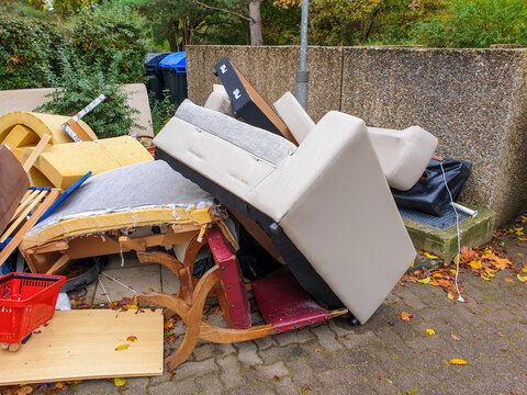 Bulky waste, garbage, unnecessary furniture, big trash on streets of Germany (Sperrm&uuml;ll). Pile large sized household garbage prepared for removal, recycling. 