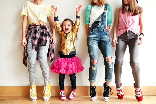 Dancing, friends and children by wall in studio with rhythm, practice or performance at rehearsal. Students, group and girl kids with training for hip hop and classical recital with lesson at academy