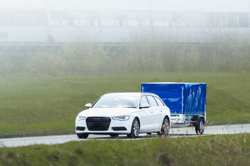 SUV and trailer used for business logistics