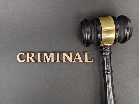 Black judge&rsquo;s gavel beside bold &ldquo;CRIMINAL&rdquo; text symbolizes legal authority, justice, and criminal law enforcement