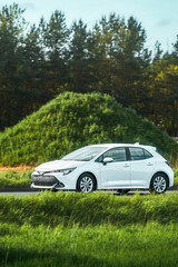 Compact urban car on countryside route