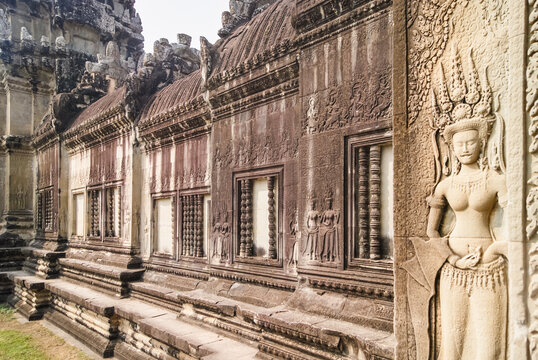 Intricate Khmer stone carvings of Devata and Apsara at Angkor Wa