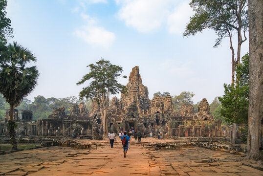 Walkway leading to Bayon Temple entrance with tourists, Cambodia
