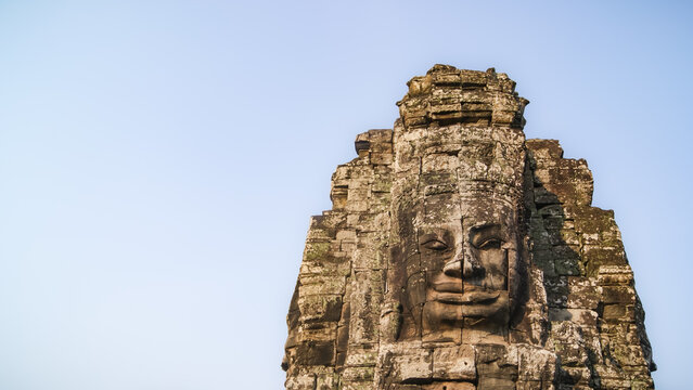 Close-up of Smiling face stone carving at Bayon Temple, Cambodia