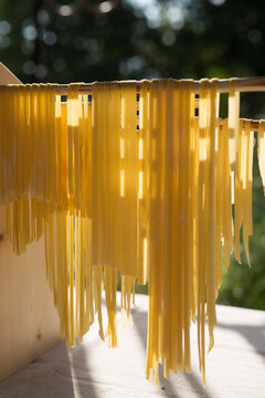 Authentic homemade tagliatelle pasta drying outside