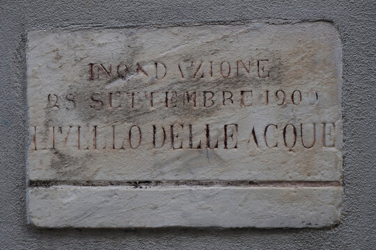 1900 flood water level sign in finalborgo medieval village in liguria italy