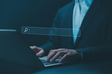 businessman using a laptop shows a search bar, and website to find a job and career on the internet. concept of keyword search engines, web browser information, SEO optimization, tool digital online