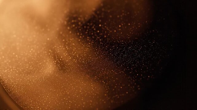 A dramatic sweep of brilliant golden and silver particles streams diagonally across a deep black background, creating an elegant, sparkling bokeh effect suitable for luxury and celebration projects.