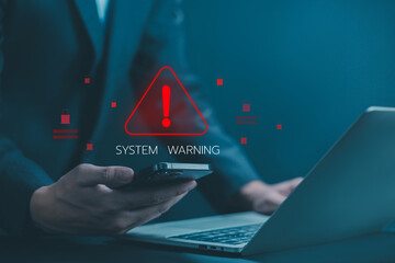 Businessman using laptop showing system warning triangle and exclamation sign icon. Warning of dangerous problems Server error. Virus. Maintenance concept. caution internet technology network security