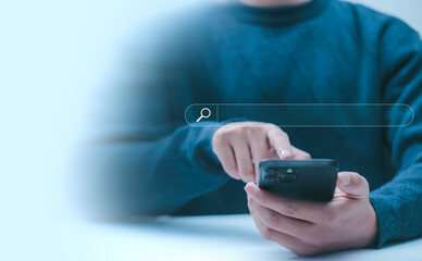 businessman using smartphone shows a search bar, and website to find a job and career on the internet. concept of keyword search engines, web browser information, SEO optimization, tool digital online