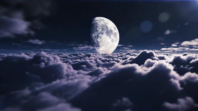 Moon above clouds in night sky