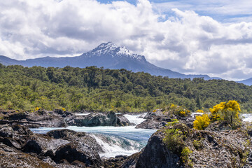 Puerto Varas, Chile: The famous Petrohue waterfall situated near Puerto Varas in Lake District of Chile with Osorno volcano covered with cloud on sunny day