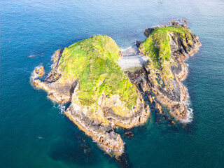 Chiloe Island, Chile: Aerial view of dramatic islet near Pu&ntilde;ihuil of Ancud in Chiloe island, Lake District of Chile on sunny day