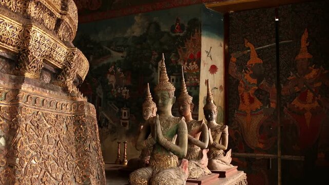 Ancient Thai angel statues in praying gesture (Wai) at  Wat Paichayon Ponsep, Thailand.