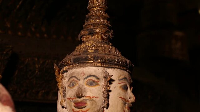 Ancient Thai angel statues in praying gesture (Wai) at  Wat Paichayon Ponsep, Thailand.