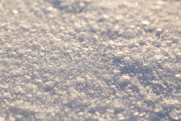background of fresh snow texture in sun tone