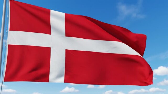 The national Flag of Denmark proudly waves in the wind against a clear blue sky