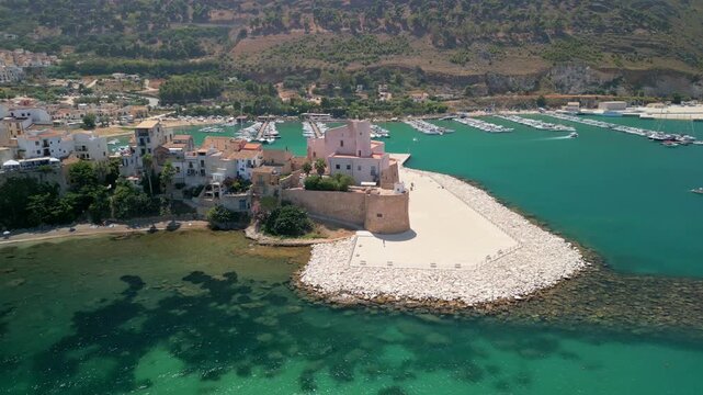 Aerial travel footage presenting Terrasini as a summer destination on Sicily&rsquo;s coast.
Drone footage capturing Terrasini&rsquo;s marina framed by open sea and coastline. Wide aerial drone shot showin