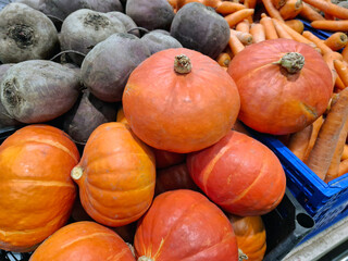 Pumpkins and beetroot on supermarket shelves