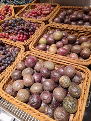 Passion fruits or marakuya and grapes at grocery store
