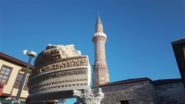 Sehzade Korkut Mosque or Kesik Minaret, seen among the historical houses in the streets of Antalya Old Town