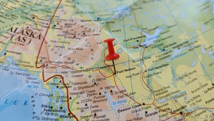Naklejka premium View of Fort Nelson, Human settlement in British Columbia, Canada, on a geographical map of America, marked with red push pin