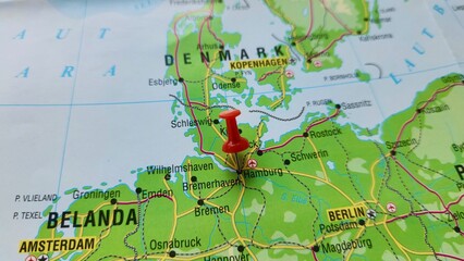 Naklejka premium View of Hamburg, City and state in the North of Germany, on a geographical map of Europe, marked with red pushpin