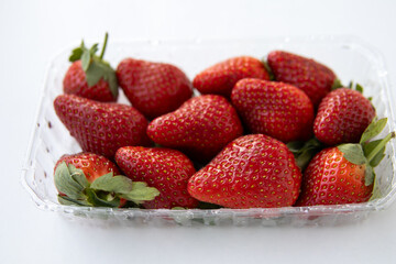 Fresh juicy strawberries close-up macro background showcasing vibrant red color, glossy surface, and rich natural texture. Extreme close-up highlighting ripeness, freshness, and appetizing detail. Con